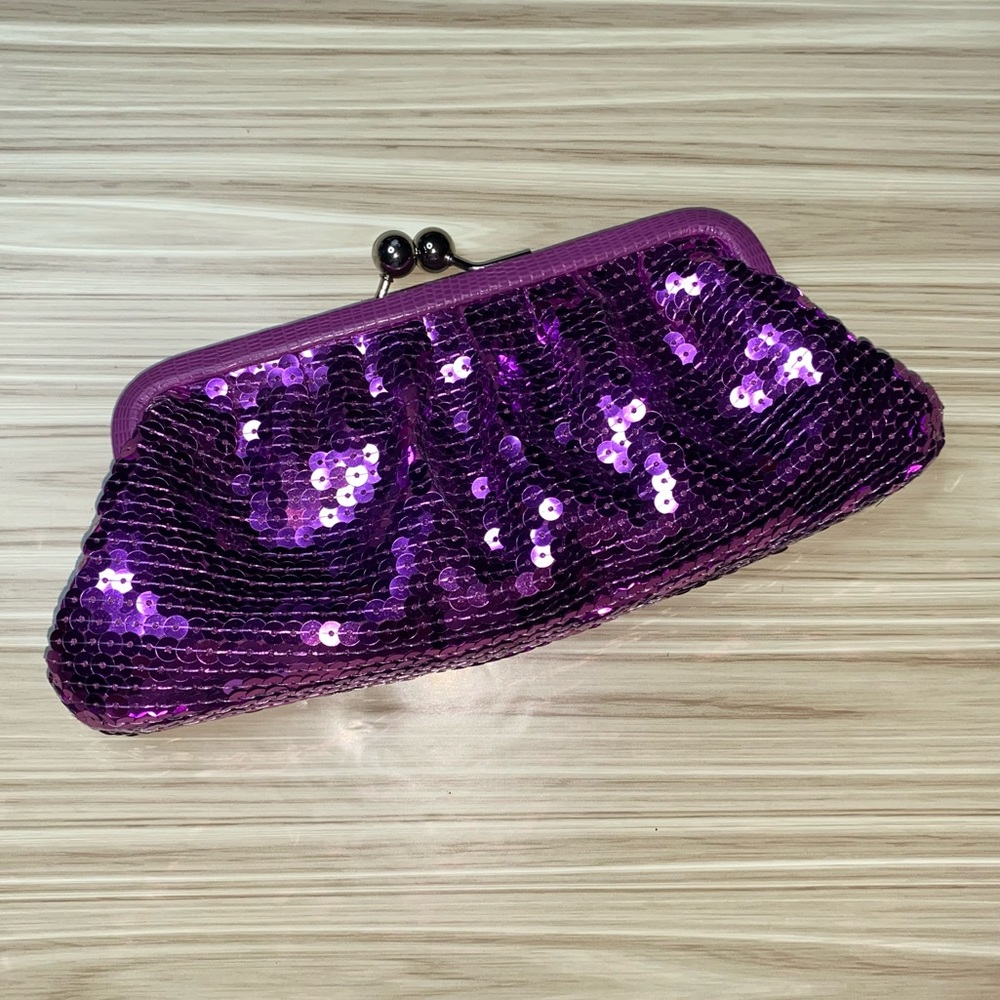 Brand new Never used Coach sequin clutch purse Mulberry in color